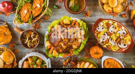 Thanksgiving dinner setting on rustic wooden table. Stock Photo