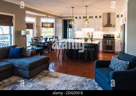 Open concept modern transitional living room and kitchen in a home. Stock Photo