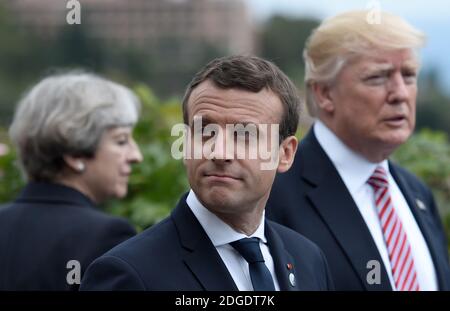 (L-R) Britain's Prime Minister Theresa May, French President Emmanuel Macron and US President Donald Trump attend the Summit of the Heads of State and of Government of the G7, the group of most industrialized economies, plus the European Union, on May 26, 2017 in Taormina, Sicily.The leaders of Britain, Canada, France, Germany, Japan, the US and Italy will be joined by representatives of the European Union and the International Monetary Fund (IMF) as well as teams from Ethiopia, Kenya, Niger, Nigeria and Tunisia during the summit from May 26 to 27, 2017. Photo by Stephane De Sakutin/ Pool /ABA Stock Photo