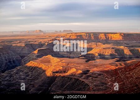 sunrise over the San Juan River, Monument Valley in the distance, Utah Stock Photo