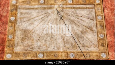 In italy sundial and   antique  wall Stock Photo