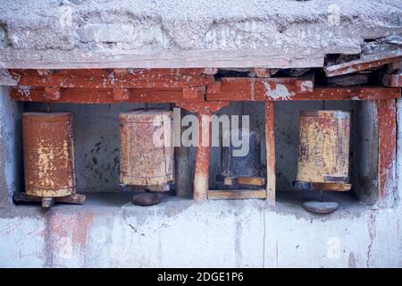 Ornate historical Buddhist prayerwheels, Alchi village, Leh District, Ladakh, Jammu & Kashmir, northern India. Stock Photo