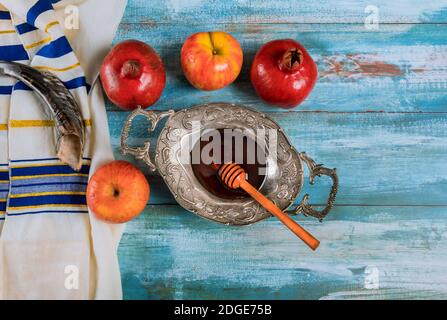 Shofar and tallit with glass honey and fresh ripe apples. Jewish new year symbols. Rosh hashanah Stock Photo