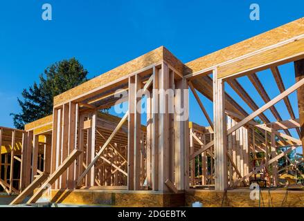 Wood frame work of new residential home under construction. Stock Photo