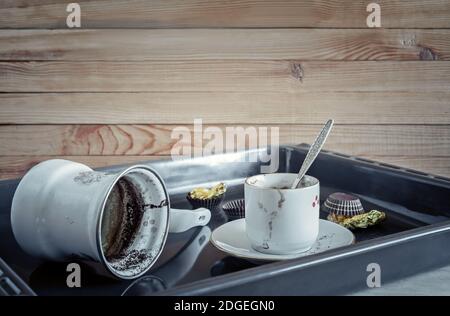 A dirty coffee Cup and saucer and a coffee mug. Stock Photo