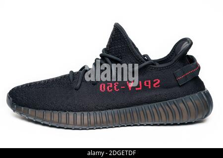 Moscow, Russia - December 2020 : Adidas Yeezy Boost 350 V2 CORE BLACK RED - Famous Limited Collection Fashion Sneakers by Kanye West and Adidas Collaboration. Stock Photo