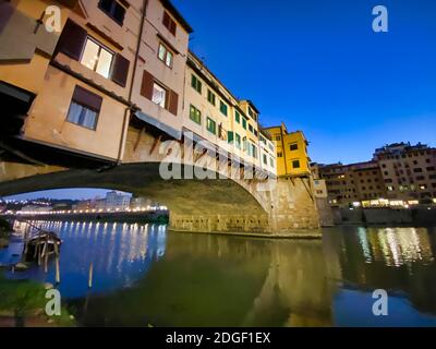 Old Bridge and Florence Lungarni at night. Panoramic cityscape in Autumn, Tuscany - Italy Stock Photo