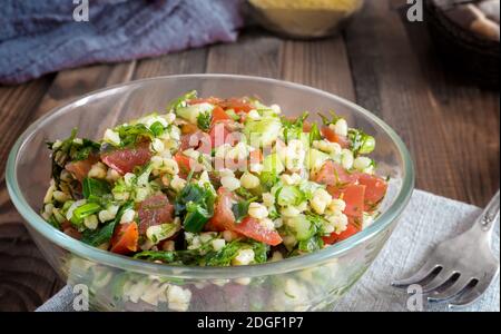 Salad Tabule - a common dish of Arabic cuisine. Stock Photo