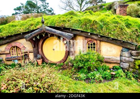 Beautiful Hobbiton Movie Set Village in New Zealand. Wooden homes in the park Stock Photo