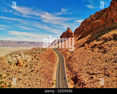 Beautiful road across the mountains of National Park, downward aerial view from drone Stock Photo