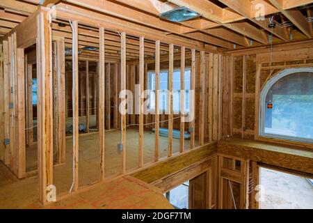 Beam stick built frame of a new house under construction Stock Photo