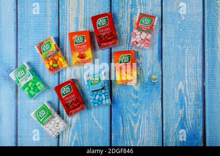 TIC TAC mint boxes of packages on wood background Stock Photo