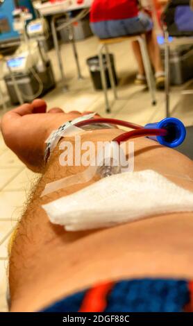 Close-up image of a man who is donating blood in a health care hospital. Stock Photo