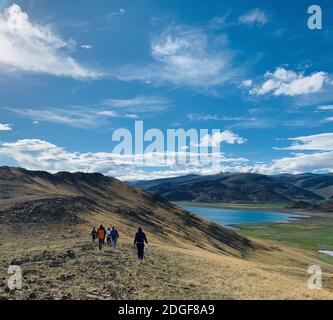 (201209) -- LHASA, Dec. 9, 2020 (Xinhua) -- Users of 'Tibet Tour', an app offering travel information about Tibet, visit Lake Yamzhog Yumco, southwest China's Tibet Autonomous Region, June 20, 2020. The charm of Tibet makes this region a mainstay of many a bucket list. Although tourism across the world has been impacted by the COVID-19 pandemic this year, Tibet remained a popular tourist destination, thanks in part to the effectiveness of its epidemic prevention and control measures. In the first three quarters of 2020, the region saw over 32 million tourist arrivals and its tourist revenue to Stock Photo