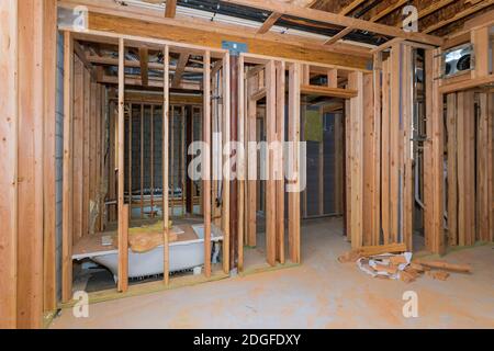 Bathroom showing plumbing work connecting installation of pipes with basement Stock Photo