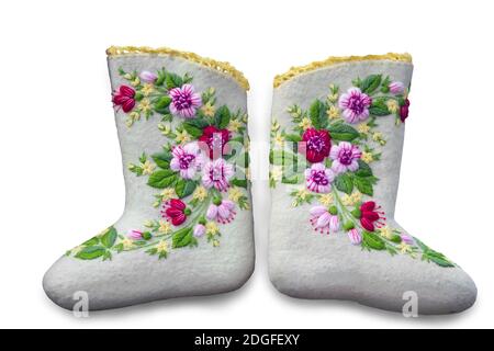 Beautiful warm shoes made of felt on a white background. Stock Photo