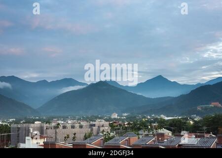 Urban scenery with mountains in Puli Stock Photo