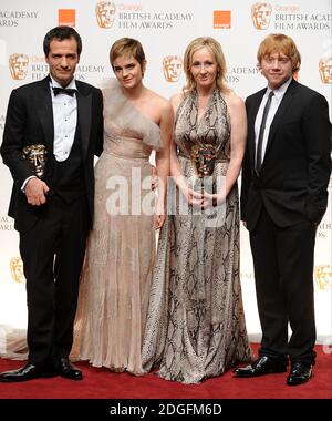 (L-R) David Heyman, Emma Watson, JK Rowling and Rupert Grint, with the Outstanding Contribution to British Cinema award received for the Harry Potter films, in the press room at the 2011 Orange British Academy Film Awards, The Royal Opera House, Covent Garden, London. Stock Photo