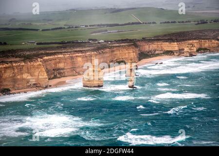 Helicopter aerial view of Twelve Apostles along Great Ocean Road during a storm - Port Campbell, Australia Stock Photo