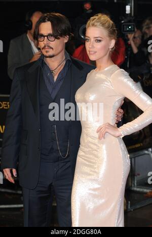 Johnny Depp and Amber Heard arriving at the European Premiere of The Rum Diary, Odeon Cinema, Kensington High St, London. Stock Photo