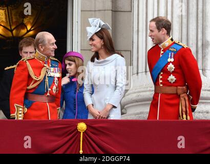 (Left to Right) Prince Harry, Prince Philip Duke of Edinburgh, Princess Eugenie, Catherine Duchess of Cambridge and Prince William Duke of Cambridge watching a Royal Air Force fly pass with their family from the balcony of Buckingham Palace after the Trooping The Colour at the Horse Guards Parade in London Stock Photo