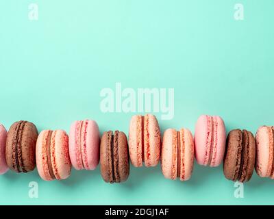 Macarons on turquoise, copy space top Stock Photo