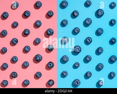Blueberry pattern on pink and blue background Stock Photo