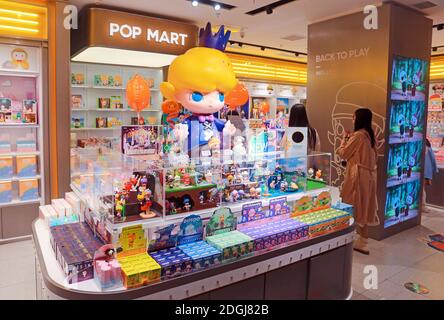 FILE--Customers wander and select products at a Pop Mart