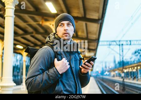 Sopot Railway station. traveler waiting for transportation. Travel concept. Man at the train station. Portrait Caucasian Male In