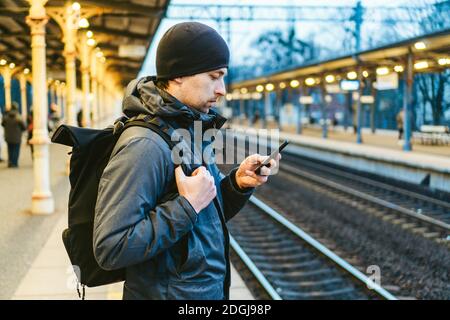 Sopot Railway station. traveler waiting for transportation. Travel concept. Man at the train station. Portrait Caucasian Male In