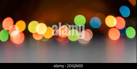 Festive multicolored bokeh background. Blurred lights of led garland. Copy space. Stock Photo