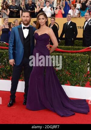 Matthew McConaughey and Camila Alves arriving on the red carpet at the 21st Annual Screen Actors Guild Awards, held at the Shrine Auditorium, Los Angeles. Stock Photo