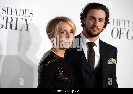 Sam Taylor-Johnson (left) and Aaron Taylor-Johnson (right) attending the UK film premiere of Fifty Shades Of Grey held at the Odeon cinema in Leicester Square, London Stock Photo