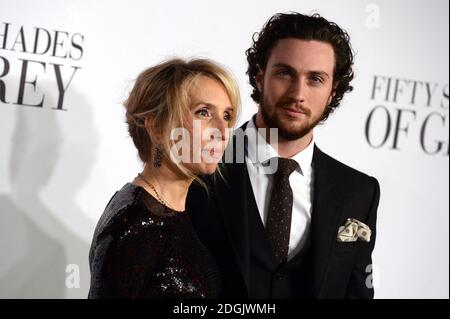 Sam Taylor-Johnson (left) and Aaron Taylor-Johnson (right) attending the UK film premiere of Fifty Shades Of Grey held at the Odeon cinema in Leicester Square, London Stock Photo