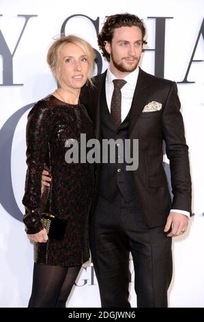 Sam Taylor-Johnson (left) and Aaron Taylor-Johnson (right) attending the UK film premiere of Fifty Shades Of Grey held at the Odeon cinema in Leicester Square, London Stock Photo