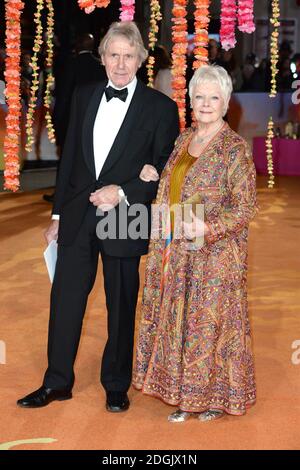David Mills and Dame Judi Dench attending the UK film premiere of The Second Best Exotic Marigold Hotel held at the Odeon cinema in Leicester Square, London Stock Photo