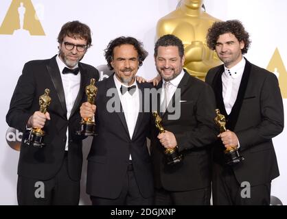 (left to right) Producer James W. Skotchdopole, actor Sean Penn, producer/director Alejandro G. Inarritu, winner of Best Original Screenplay, Best Director, and Best Motion Picture, for 'Birdman' and producer John Lesher, in the press room of the 87th Academy Awards held at the Dolby Theatre in Hollywood, Los Angeles, CA, USA, February 22, 2015. Stock Photo