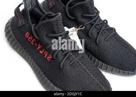 Moscow, Russia - December 2020 : Adidas Yeezy Boost 350 V2 CORE BLACK RED - Famous Limited Collection Fashion Sneakers by Kanye West and Adidas Collaboration. Stock Photo