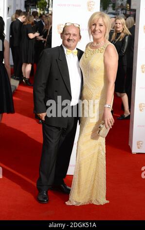 Brendan O'Carroll and Jennifer Gibney arriving at the House of Fraser British Academy Television Awards held at the Theatre Royal, London  (Mandatory Credit: Doug Peters/EMPICS Entertainment) Stock Photo