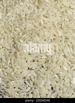 Top view concept for Japanese rice. Background and texture of Japanese rice  for your web design and wallpaper. Japanese rice in gunny sack and wood  spoon put on rustic wood table. Stock