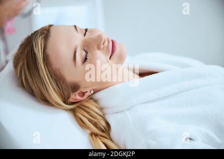 Calm patient relaxing before a beauty procedure Stock Photo