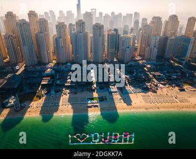 Aerial view of JBR beach and Dubai Marina skyscrapers and luxury buildings in one of the United Arab Emirates travel spots and resorts in Dubai Stock Photo