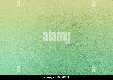 Green concrete background with abstract textured pattern applied to the surface. Stock Photo