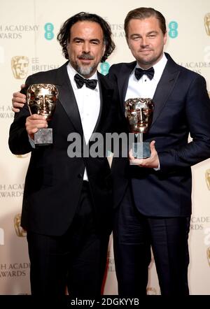 Leonardo DiCaprio (right) with the BAFTA for Leading Actor for 'The Revenant' and Alejandro Gonzalez Inarritu (left) with the Best Director BAFTA, in the press room during the EE British Academy Film Awards at the Royal Opera House, Bow Street, London.  EMPICS Entertainment Photo. Picture date: Sunday February 14, 2016. Photo credit should read: Doug Peters/ EMPICS Entertainment Stock Photo