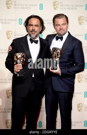 Leonardo DiCaprio (right) with the BAFTA for Leading Actor for 'The Revenant' and Alejandro Gonzalez Inarritu (left) with the Best Director BAFTA, in the press room during the EE British Academy Film Awards at the Royal Opera House, Bow Street, London.  EMPICS Entertainment Photo. Picture date: Sunday February 14, 2016. Photo credit should read: Doug Peters/ EMPICS Entertainment Stock Photo