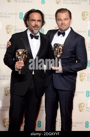 Leonardo DiCaprio (right) with the BAFTA for Leading Actor for 'The Revenant' and Alejandro Gonzalez Inarritu (left) with the Best Director BAFTA, in the press room during the EE British Academy Film Awards at the Royal Opera House, Bow Street, London.  EMPICS Entertainment Photo. Picture date: Sunday February 14, 2016. Photo credit should read: Doug Peters/ EMPICS Entertainment Stock Photo