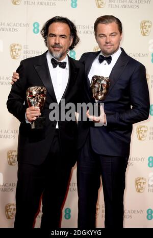 Leonardo DiCaprio (right) with the BAFTA for Leading Actor for 'The Revenant' and Alejandro Gonzalez Inarritu (left) with the Best Director BAFTA, in the press room during the EE British Academy Film Awards at the Royal Opera House, Bow Street, London.  EMPICS Entertainment Photo. Picture date: Sunday February 14, 2016. Photo credit should read: Doug Peters/ EMPICS Entertainment Stock Photo