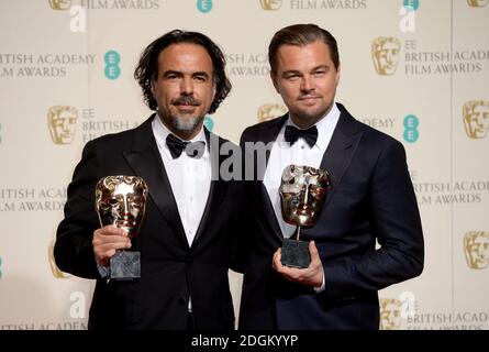 Leonardo DiCaprio (right) with the BAFTA for Leading Actor for 'The Revenant' and Alejandro Gonzalez Inarritu (left) with the Best Director BAFTA, in the press room during the EE British Academy Film Awards at the Royal Opera House, Bow Street, London.  EMPICS Entertainment Photo. Picture date: Sunday February 14, 2016. Photo credit should read: Doug Peters/ EMPICS Entertainment Stock Photo