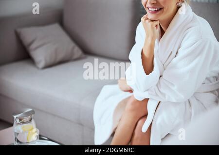 Smiling woman on the sofa in a beauty salon Stock Photo