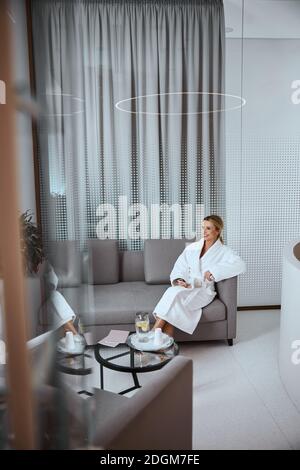 Merry lady spending time in a beauty salon Stock Photo